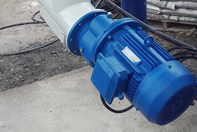 Cement auger with safety valve and vibrating de-dusting system